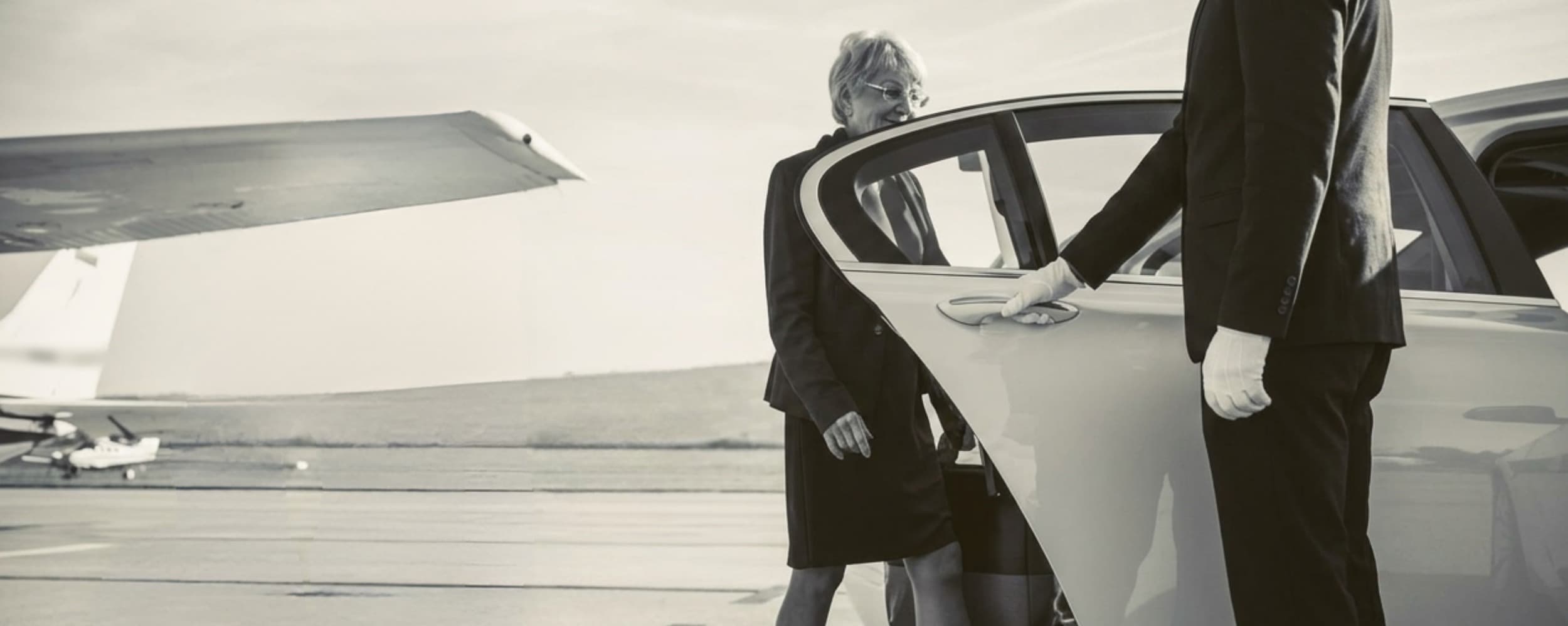 Airport transfer driver with a passenger in the car